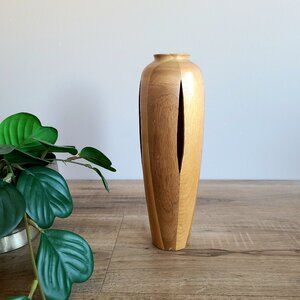 Wooden hand carved vase with cuts design.